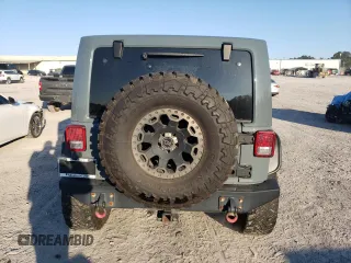 2013 Jeep Wrangler Unlimited Rubicon 10th Anniversary z VIN 1C4HJWFG0DL704100, wystawiony jako Copart lot #75573634 z przebiegiem 103 158 mil mil oraz Szkoda całkowita • Salvage title. Historia ofert i sprzedaży dostępna na DreamBid. Obrazek 6.