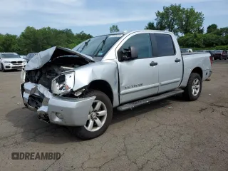 2010 Nissan Titan XE with VIN 1N6AA0EC9AN322027, listed as a Copart auction lot 64488315 with 196,031 mi miles and Salvage title. Bid and sale history available at DreamBid. Image 1.