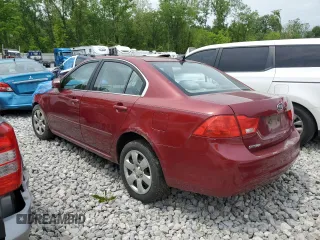 2009 Kia Optima LX z VIN KNAGE228795334599, wystawiony jako Copart lot #59276515 z przebiegiem 180 399 mil mil oraz Szkoda całkowita • Salvage title. Historia ofert i sprzedaży dostępna na DreamBid. Obrazek 2.