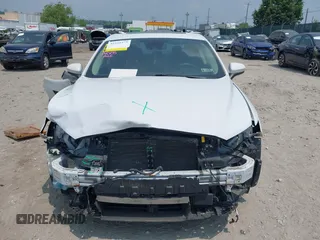 2020 Ford Fusion SE with VIN 3FA6P0LUXLR155881, listed as a IAAI auction lot 42426199 with 103,809 mi miles and . Bid and sale history available at DreamBid. Image 13.