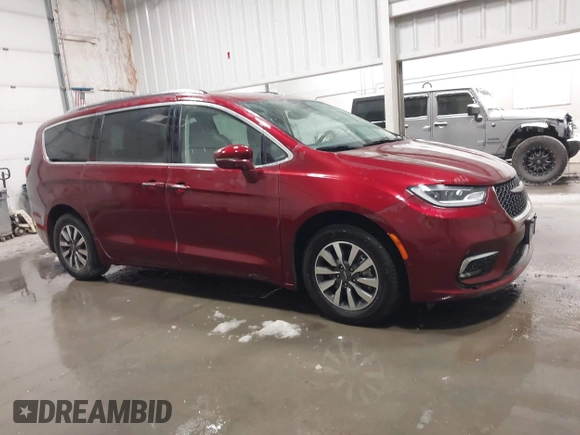 2021 Chrysler Pacifica Hybrid Touring L with VIN 2C4RC1L71MR581260, listed as a IAAI auction lot 42014401 with 68,719 mi miles and . Bid and sale history available at DreamBid. Image 13.