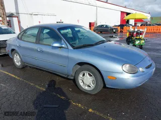 1997 Ford Taurus GL with VIN 1FALP52U5VG156139, listed as a IAAI auction lot 41642820 with 73,480 mi miles. Bid and sale history available at carsss.com. Image 1.