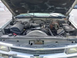 1997 Chevrolet Tahoe with VIN 1GNEK13R6VJ443195, listed as a IAAI auction lot 42000733 with 202,106 mi miles. Bid and sale history available at carsss.com. Image 10.