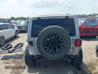 2021 Jeep Wrangler Unlimited High Altitude with VIN 1C4HJXEG3MW511185, listed as a IAAI auction lot 42125883 with 45,564 mi miles and . Bid and sale history available at DreamBid. Image 16.
