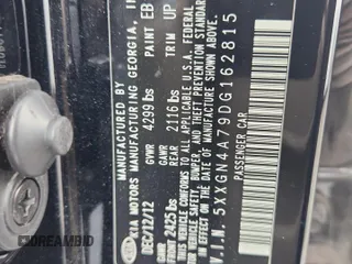 2013 Kia Optima EX z VIN 5XXGN4A79DG162815, wystawiony jako Copart lot #59282275 z przebiegiem 163 920 mil mil oraz Szkoda całkowita • Salvage title. Historia ofert i sprzedaży dostępna na DreamBid. Obrazek 12.