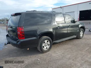 2010 Chevrolet Suburban LS with VIN 1GNUKHE38AR190423, listed as a IAAI auction lot 41655080 with 215,187 mi miles and . Bid and sale history available at DreamBid. Image 4.