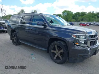 2015 Chevrolet Suburban LT z VIN 1GNSKJKCXFR550883, wystawiony jako IAAI lot #42211688 z przebiegiem 164 583 mil mil oraz . Historia ofert i sprzedaży dostępna na DreamBid. Obrazek 1.