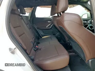 2023 BMW X1 xDrive28i with VIN WBX73EF06P5V77660, listed as a Copart auction lot 57342015 with 32,028 mi miles and Salvage title. Bid and sale history available at DreamBid. Image 11.