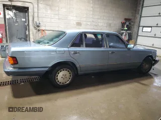 1986 Mercedes-Benz 560 with VIN WDBCA39DXGA213770, listed as a Copart auction lot 49787355 with 218,547 mi miles and Salvage Title. Bid and sale history available at DreamBid. Image 3.