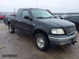 2000 Ford F-150 XL with VIN 1FTRX18LXYNA76850, listed as a IAAI auction lot 41384438 with 167,471 mi miles. Bid and sale history available at carsss.com. Image 1.