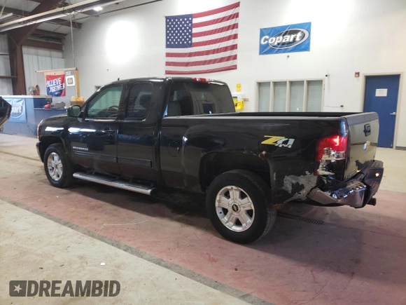 2013 Chevrolet Silverado 1500 LTZ with VIN 1GCRKTE72DZ414083, listed as a Copart auction lot 49009385 with 180,241 mi miles and Salvage Title. Bid and sale history available at DreamBid. Image 2.