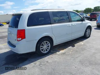 2014 Dodge Grand Caravan SXT with VIN 2C4RDGCGXER322705, listed as a IAAI auction lot 42170301 with 147,070 mi miles and . Bid and sale history available at DreamBid. Image 4.