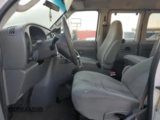2006 Ford Econoline Passenger XL with VIN 1FBSS31L66DA77295, listed as a Copart auction lot 77022084 with 279,140 mi miles and Salvage Title. Bid and sale history available at carsss.com. Image 7.