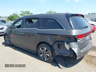 2014 Honda Odyssey Touring with VIN 5FNRL5H90EB082691, listed as a IAAI auction lot 42572977 with 54,413 mi miles and . Bid and sale history available at DreamBid. Image 3.
