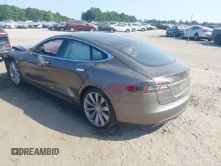 2016 Tesla Model S 70 with VIN 5YJSA1E1XGF126620, listed as a IAAI auction lot 40227035 with 71,400 mi miles and . Bid and sale history available at DreamBid. Image 3.