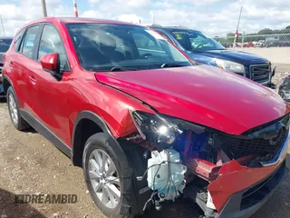 2015 Mazda CX-5 Sport with VIN JM3KE2BE8F0451014, listed as a IAAI auction lot 42536333 with 131,059 mi miles and . Bid and sale history available at DreamBid. Image 6.
