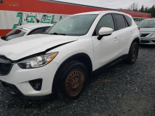 2014 Mazda CX-5 Touring z VIN JM3KE4CY1E0406726, wystawiony jako Copart lot #54652065 z przebiegiem 245 491 mil mil oraz Szkoda całkowita • Salvage title. Historia ofert i sprzedaży dostępna na DreamBid. Obrazek 1.
