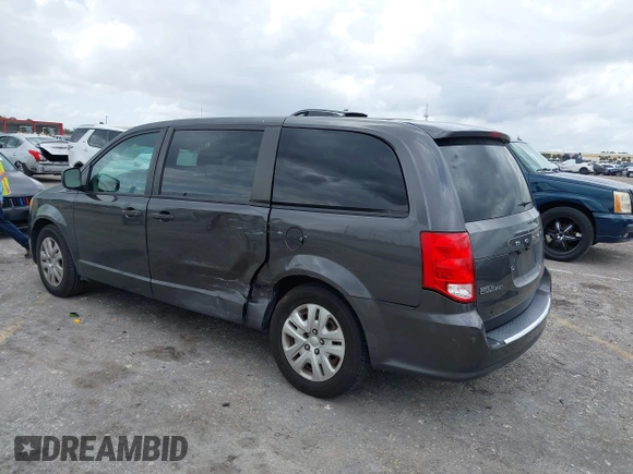 2019 Dodge Grand Caravan SE with VIN 2C4RDGBGXKR796974, listed as a IAAI auction lot 42008704 with 129,229 mi miles and . Bid and sale history available at DreamBid. Image 3.