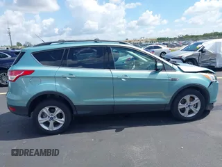 2013 Ford Escape SE with VIN 1FMCU9GX0DUC75662, listed as a IAAI auction lot 42549360 with 156,666 mi miles and . Bid and sale history available at DreamBid. Image 13.