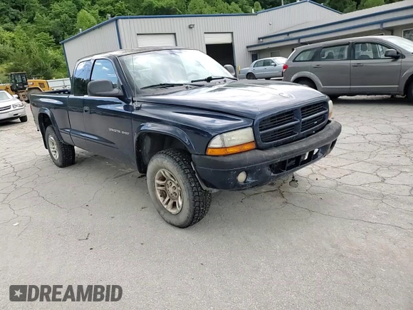 2002 Dodge Dakota z VIN 1B7GG32X32S546515, wystawiony jako Copart lot #57888695 z przebiegiem 81 202 mil mil oraz Szkoda całkowita • Salvage title. Historia ofert i sprzedaży dostępna na DreamBid. Obrazek 13.