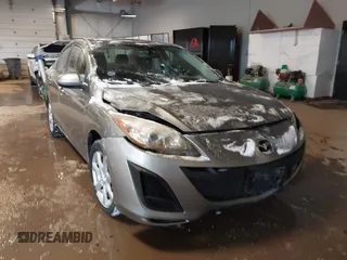 2011 Mazda Mazda3 i Touring with VIN JM1BL1VF4B1446135, listed as a IAAI auction lot 41586943 with 137,764 mi miles. Bid and sale history available at carsss.com. Image 1.
