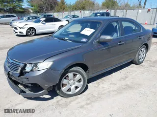 2009 Kia Optima LX with VIN KNAGE228195301338, listed as a IAAI auction lot 41904987 with 153,197 mi miles. Bid and sale history available at carsss.com. Image 2.