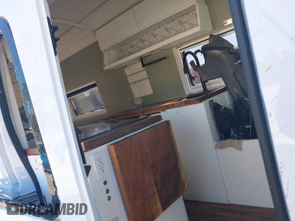 2022 Ford Transit Cargo with VIN 1FTBW3U85NKA01097, listed as a IAAI auction lot 41076643 with 24,786 mi miles and . Bid and sale history available at DreamBid. Image 8.