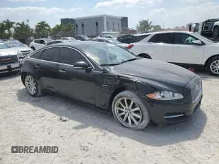 2012 Jaguar XJ with VIN SAJWA1CB5CLV27448, listed as a Copart auction lot 53373985 with 90,603 mi miles and Salvage Title. Bid and sale history available at DreamBid. Image 4.