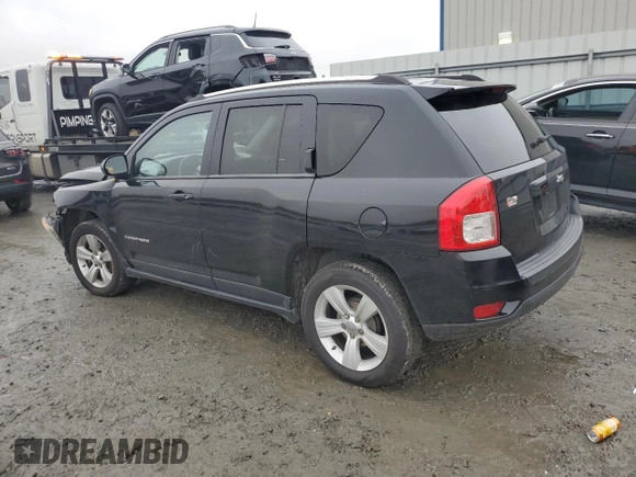2012 Jeep Compass Sport with VIN 1C4NJCBB2CD613575, listed as a Copart auction lot 85057354 with 203,677 mi miles and Salvage Title. Bid and sale history available at carsss.com. Image 2.