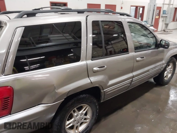 1999 Jeep Grand Cherokee Limited with VIN 1J4GW68N7XC752314, listed as a IAAI auction lot 41776905 with 228,023 mi miles. Bid and sale history available at carsss.com. Image 6.