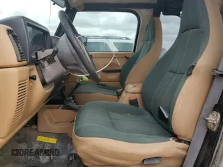 1998 Jeep Wrangler Sahara with VIN 1J4FY49S0WP749826, listed as a Copart auction lot 55174205 with 203,574 mi miles and Salvage title. Bid and sale history available at DreamBid. Image 7.