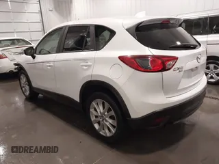 2015 Mazda CX-5 Grand Touring with VIN JM3KE4DY4F0495627, listed as a IAAI auction lot 41887773 with 130,421 mi miles. Bid and sale history available at carsss.com. Image 3.