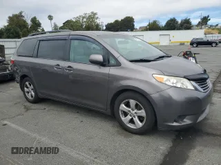 2015 Toyota Sienna LE AAS with VIN 5TDKK3DC1FS577795, listed as a Copart auction lot 66215355 with 197,902 mi miles and Salvage title. Bid and sale history available at DreamBid. Image 4.