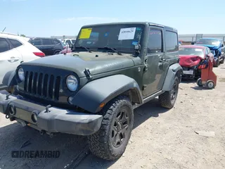 2015 Jeep Wrangler Sport with VIN 1C4AJWAGXFL650428, listed as a IAAI auction lot 42010629 with 80,039 mi miles. Bid and sale history available at carsss.com. Image 2.