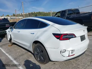 2020 Tesla Model 3 Standard Range Plus with VIN 5YJ3E1EA1LF615250, listed as a IAAI auction lot 41444030 with 76,810 mi miles. Bid and sale history available at carsss.com. Image 3.