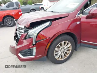 2017 Cadillac XT5 FWD with VIN 1GYKNARS2HZ107587, listed as a IAAI auction lot 41614842 with 124,611 mi miles and . Bid and sale history available at carsss.com. Image 6.