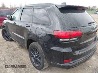 2021 Jeep Grand Cherokee 80th Anniversary with VIN 1C4RJFBG7MC828116, listed as a IAAI auction lot 42118355 with 57,240 mi miles and . Bid and sale history available at DreamBid. Image 3.