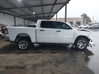 2023 Ram 1500 Big Horn z VIN 1C6RRFFG7PN698664, wystawiony jako IAAI lot #41103495 z przebiegiem 34 307 mil mil oraz . Historia ofert i sprzedaży dostępna na DreamBid. Obrazek 14.