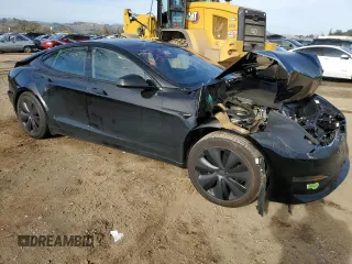 2023 Tesla Model S with VIN 5YJSA1E57PF507456, listed as a Copart auction lot 44649945 with 8,760 mi miles and Salvage title. Bid and sale history available at DreamBid. Image 4.