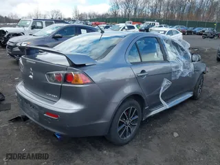 2017 Mitsubishi Lancer ES with VIN JA32U2FU7HU000552, listed as a IAAI auction lot 41868342 with 136,132 mi miles. Bid and sale history available at carsss.com. Image 4.