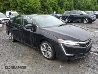 2018 Honda Clarity Touring z VIN JHMZC5F38JC007547, wystawiony jako Copart lot #57199735 z przebiegiem 176 149 mil mil oraz Czysty tytuł • Clean title. Historia ofert i sprzedaży dostępna na DreamBid. Obrazek 4.