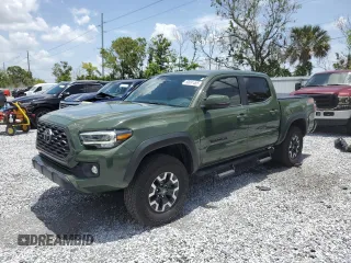 2022 Toyota Tacoma SR with VIN 3TMCZ5AN4NM469204, listed as a Copart auction lot 60891465 with 33,311 mi miles and Salvage title. Bid and sale history available at DreamBid. Image 1.