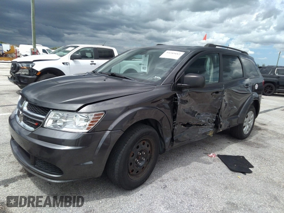 2018 Dodge Journey SE with VIN 3C4PDCAB4JT296083, listed as a IAAI auction lot 41976090 with 63,051 mi miles and . Bid and sale history available at DreamBid. Image 2.