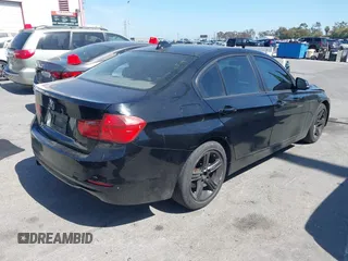 2014 BMW 3 Series 320i with VIN WBA3B1G5XENS80130, listed as a IAAI auction lot 42304306 with 125,743 mi miles and . Bid and sale history available at DreamBid. Image 4.