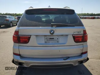 2012 BMW X5 35i with VIN 5UXZV4C5XCL749204, listed as a Copart auction lot 62012985 with 94,636 mi miles and Clean title. Bid and sale history available at DreamBid. Image 6.