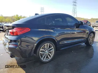 2018 BMW X4 M40i with VIN 5UXXW7C54J0Z44932, listed as a Copart auction lot 55973605 with 101,479 mi miles and Salvage title. Bid and sale history available at DreamBid. Image 3.