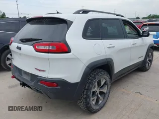 2015 Jeep Cherokee Trailhawk with VIN 1C4PJMBS9FW623740, listed as a IAAI auction lot 42131019 with 155,105 mi miles and . Bid and sale history available at DreamBid. Image 4.