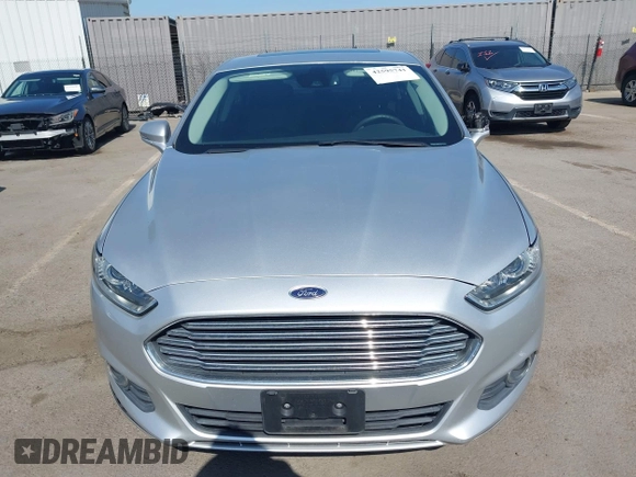 2016 Ford Fusion SE Hybrid z VIN 3FA6P0LU8GR203934, wystawiony jako IAAI lot #42595741 z przebiegiem 84 189 mil mil oraz . Historia ofert i sprzedaży dostępna na DreamBid. Obrazek 13.