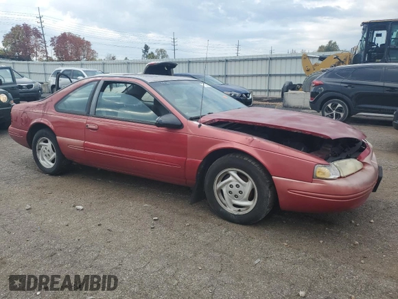 1996 Ford Thunderbird LX z VIN 1FALP62W7TH135632, wystawiony jako Copart lot #77134024 z przebiegiem 128 931 mil mil oraz Szkoda całkowita • Salvage title. Historia ofert i sprzedaży dostępna na DreamBid. Obrazek 4.