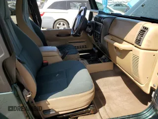 2000 Jeep Wrangler Sahara z VIN 1J4FA59S1YP746043, wystawiony jako Copart lot #58842665 z przebiegiem 148 348 mil mil oraz Szkoda całkowita • Salvage title. Historia ofert i sprzedaży dostępna na DreamBid. Obrazek 7.